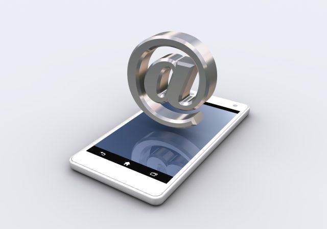 email symbol and smartphone