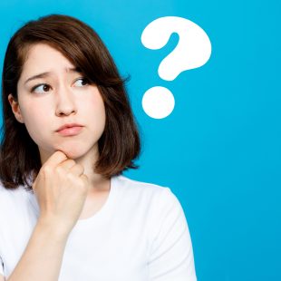 young woman and question marks.