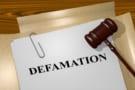 Render illustration of Defamation title on Legal Documents